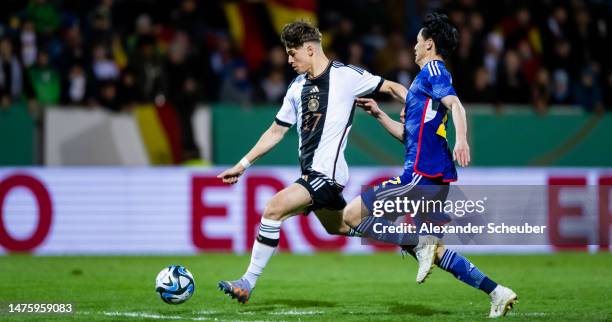 Noah Weisshaupt of Germany in action against Uchino Takashi of Japan during the Under-21 friendly match between Germany and Japan at PSD Bank Arena...