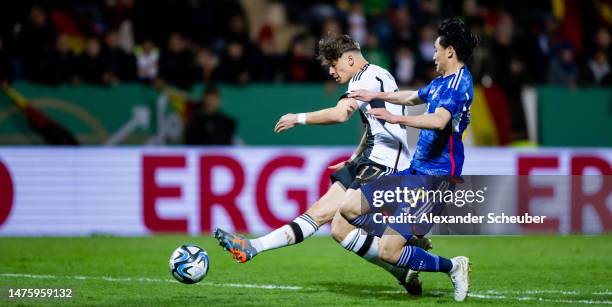 Noah Weisshaupt of Germany in action against Uchino Takashi of Japan during the Under-21 friendly match between Germany and Japan at PSD Bank Arena...