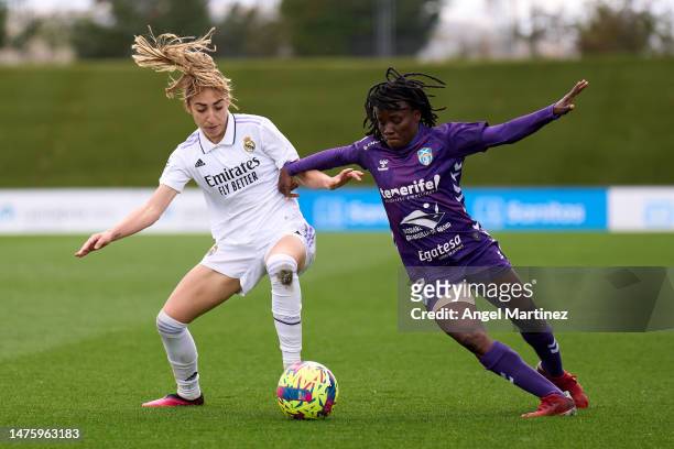 Olga Carmona of Real Madrid competes for the ball with Koko Ange N'Guessan of UDG Tenerife during the Liga F match between Real Madrid and UDG...