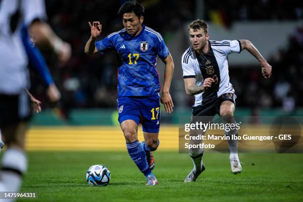 Kimura Yudai of Japan is followed by Louis Jordan Beyer of Germany at PSD Bank Arena on March 24, 2023 in Frankfurt am Main, Germany.