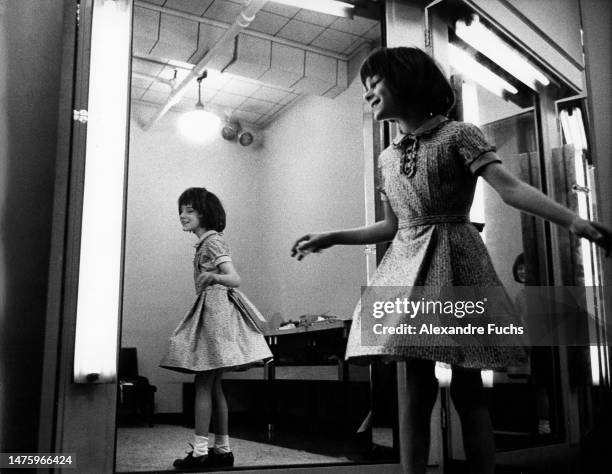 Actresses Mary Badham dressing up and dancing in front of a mirror for her role in the movie "To Kill A Mockingbird", in 1961 at Monroeville, Alabama.