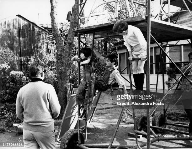 Actors John Megna and Philip Alford and actresses Mary Badham playing in the set of the film "To Kill A Mockingbird", in 1961 at Monroeville, Alabama.