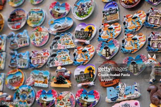 fridge magnets for sale at street market, madrid, spain - excess product stock pictures, royalty-free photos & images
