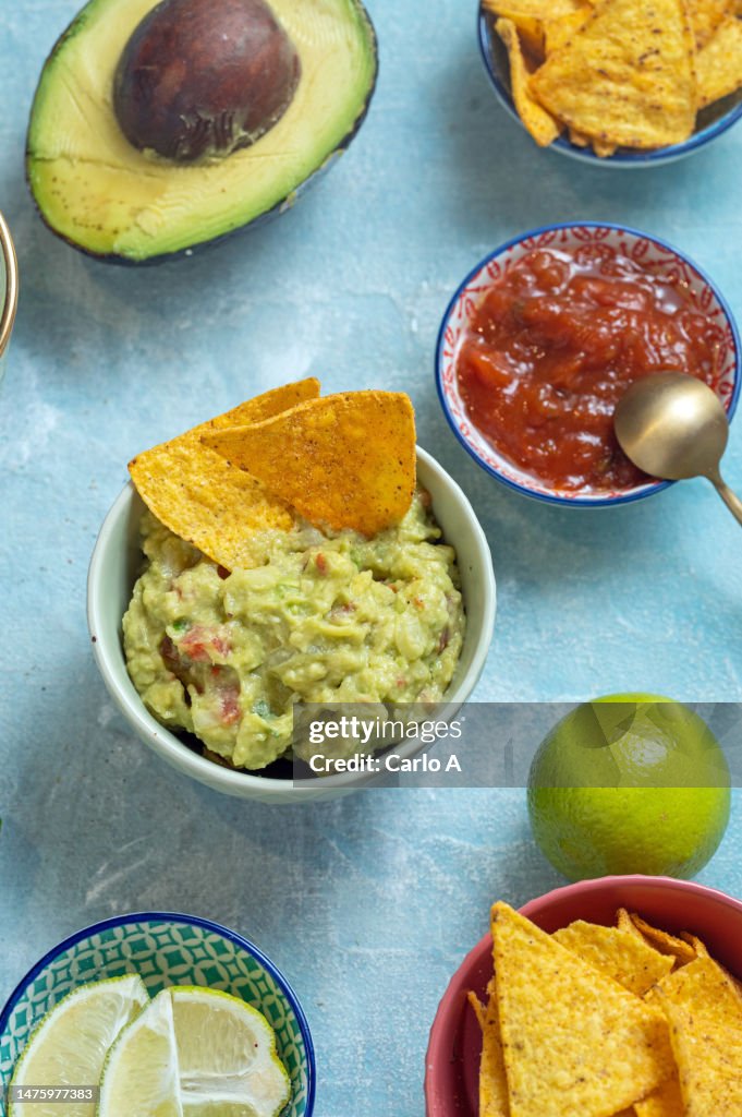 Guacamole and nachos in a bowl