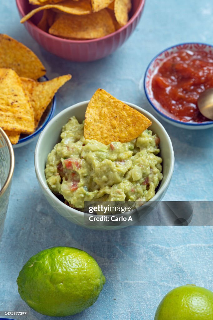Guacamole and nachos in a bowl