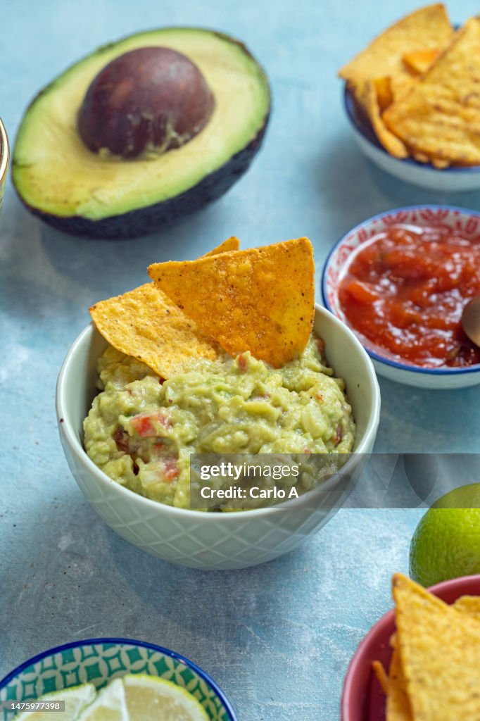 Guacamole and nachos in a bowl