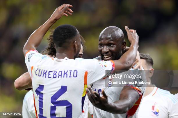 Romelu Lukaku of Belgium celebrates with teammate Dodi Lukebakio after scoring the team's first goal during the UEFA EURO 2024 qualifying round group...