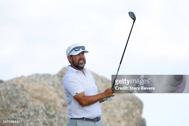 Erik Compton of the United States watches his shot from the eighth tee during the second round of the Corales Puntacana Championship at Puntacana...