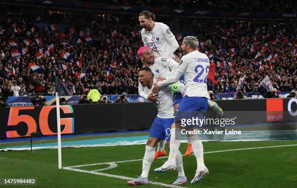 Antoine Griezmann of Team France celebrate his first goal with captain, Kylian Mbappe, Theo Hernandez and Adrien Rabiot during the UEFA EURO 2024...