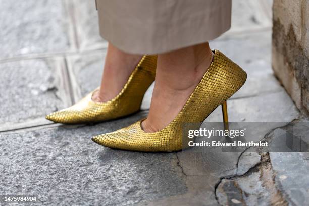 Gili Biegun wears golden colored glitter pump pointed shoes by Balenciaga, during a street style fashion photo session, on March 24, 2023 in Paris,...