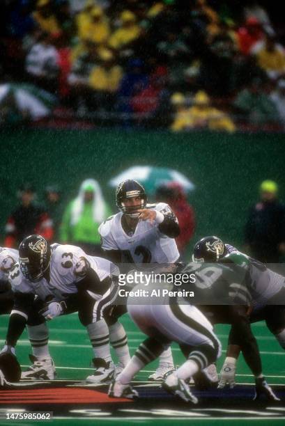 Quarterback Vinny Testaverde of the Baltimore Ravens calls a play in the rain in the game between the Baltimore Ravens vs the New York Jets at The...