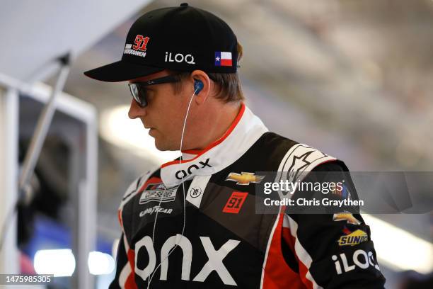 Kimi Raikkonen, driver of the Onx Homes/iLOQ Chevrolet, looks on in the garage area during practice for the NASCAR Cup Series EchoPark Automotive...