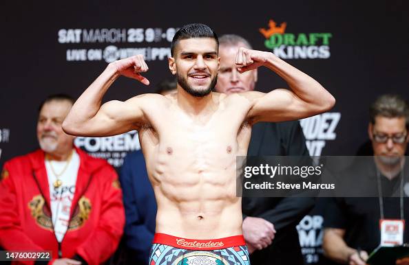 Super welterweight boxer Jesus Ramos poses on the scale during an ...