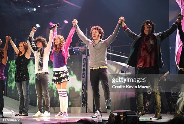 Nick Jonas, Miley Cyrus, Kevin Jonas and Joe Jonas of the Jonas Brothers perform during her "Miley Cyrus/Hannah Montana: Best of Both Worlds" Tour at...