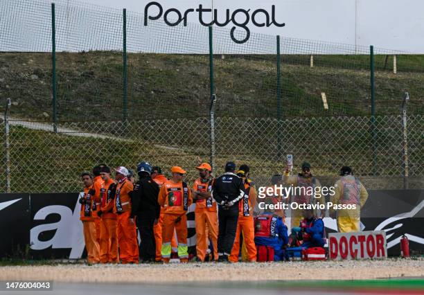 Spanish MotoGP rider Pol Espargaro of GASGAS Factory Racing Tech3 is assisted by a medical team after a fall during the MotoGP Free Practice at...