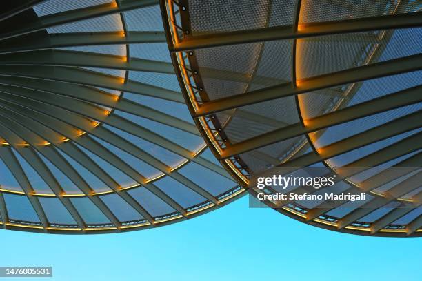 illuminated glass structure rims - architecture close up stock pictures, royalty-free photos & images