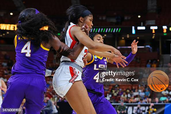 Dasia Young of the Utah Utes is fouled by Flau'jae Johnson of the LSU ...