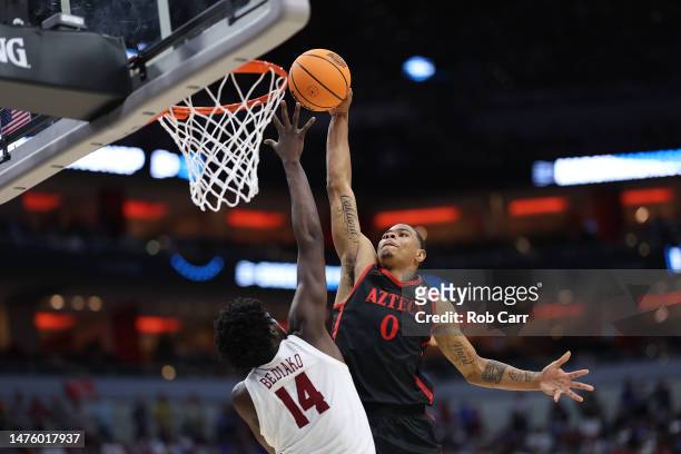 Keshad Johnson of the San Diego State Aztecs attempts to dunk against Charles Bediako of the Alabama Crimson Tide during the second half in the Sweet...