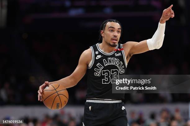 Tre Jones of the San Antonio Spurs dribbles the ball up the court against the Washington Wizards during the first half at Capital One Arena on March...