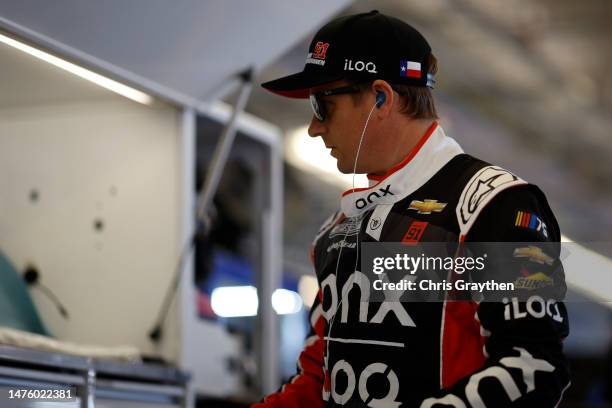 Kimi Raikkonen, driver of the Onx Homes/iLOQ Chevrolet, looks on in the garage area during practice for the NASCAR Cup Series EchoPark Automotive...
