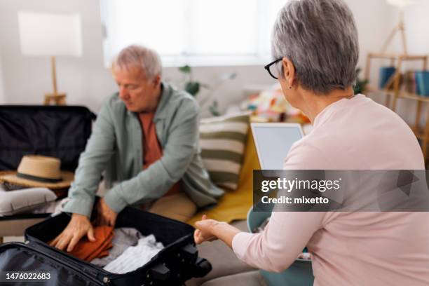 packing for a vacation - packing cases stock pictures, royalty-free photos & images