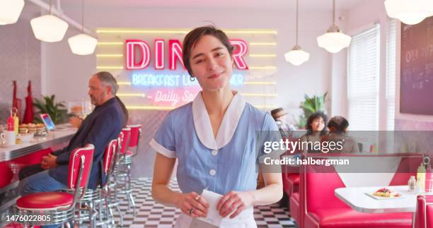 pov shot of waitress looking at camera in 1950s styled diner - waitress booth stock pictures, royalty-free photos & images