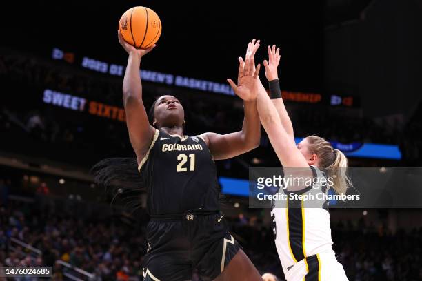 Aaronette Vonleh of the Colorado Buffaloes shoots the ball over Monika Czinano of the Iowa Hawkeyes during the second quarter in the Sweet 16 round...