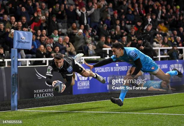 Falcons wing Adam Radwan dives in the corner to score the opening Falcons try despite the attentions of Gloucester player Santi Carreras during the...