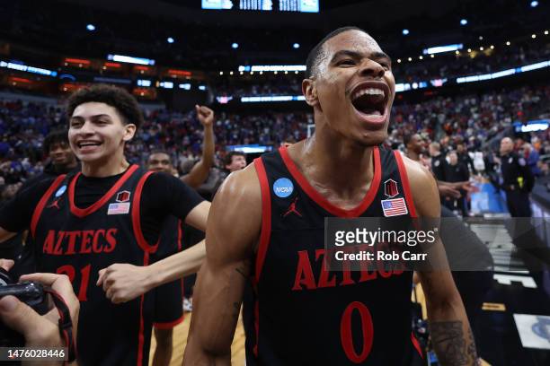 Keshad Johnson of the San Diego State Aztecs and Miles Byrd of the San Diego State Aztecs celebrate after defeating the Alabama Crimson Tide, 71-64,...