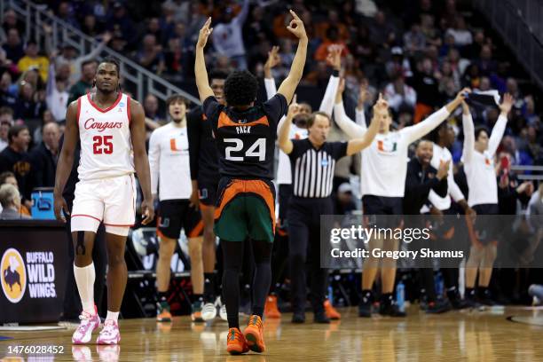 Nijel Pack of the Miami Hurricanes celebrates a three-point basket against Jarace Walker of the Houston Cougars during the second half in the Sweet...