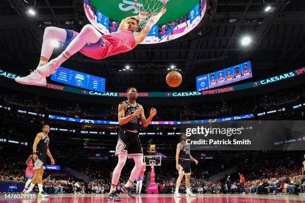 Kristaps Porzingis of the Washington Wizards dunks against the San Antonio Spurs during the first half at Capital One Arena on March 24, 2023 in...