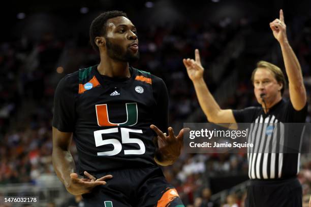 Wooga Poplar of the Miami Hurricanes celebrates a three-point basket against the Houston Cougars during the second half in the Sweet 16 round of the...