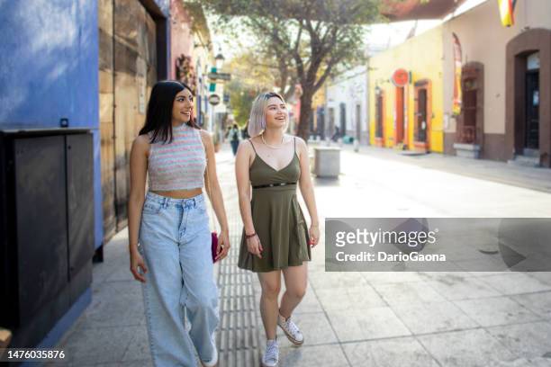 friends walking through the city - nuevo leon state stock pictures, royalty-free photos & images