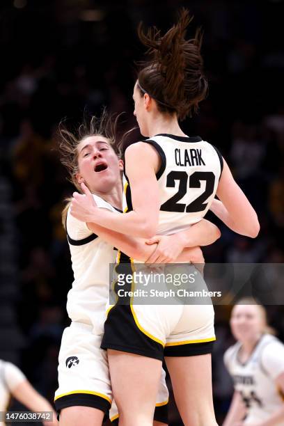 Kate Martin and Caitlin Clark of the Iowa Hawkeyes celebrate during the third quarter against the Colorado Buffaloes in the Sweet 16 round of the...