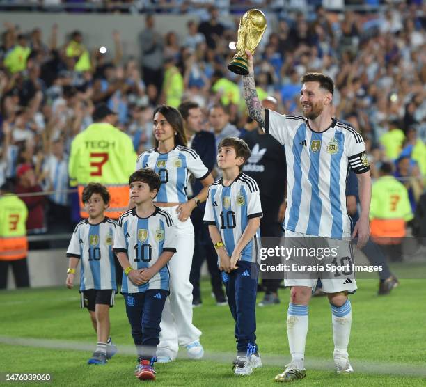 Lionel Messi of Argentina and wife Antonella Roccuzzo walk on the pitch during an international friendly between Argentina and Panama at Estadio...
