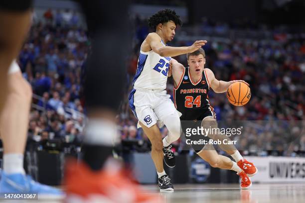 Blake Peters of the Princeton Tigers drives against Trey Alexander of the Creighton Bluejays during the first half in the Sweet 16 round of the NCAA...