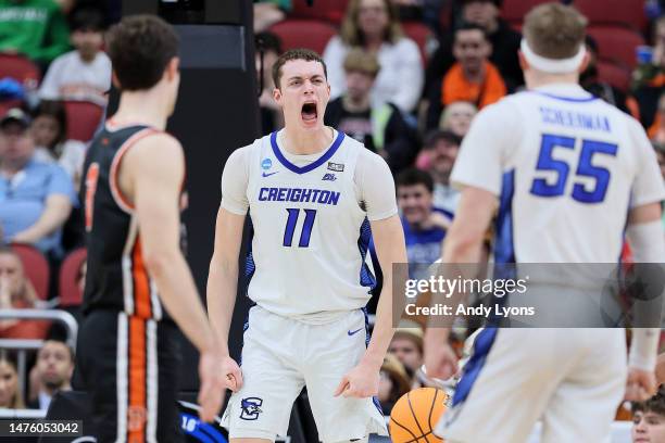 Ryan Kalkbrenner of the Creighton Bluejays reacts after dunking against Zach Martini of the Princeton Tigers during the first half in the Sweet 16...