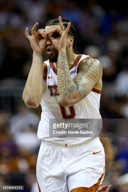 Timmy Allen of the Texas Longhorns celebrates after scoring against the Xavier Musketeers during the first half in the Sweet 16 round of the NCAA...