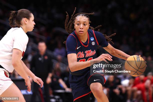 Madison Scott of the Ole Miss Rebels dribbles the ball against the Louisville Cardinals during the third quarter in the Sweet 16 round of the NCAA...