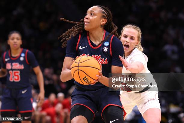 Madison Scott of the Ole Miss Rebels dribbles the ball against the Louisville Cardinals during the third quarter in the Sweet 16 round of the NCAA...