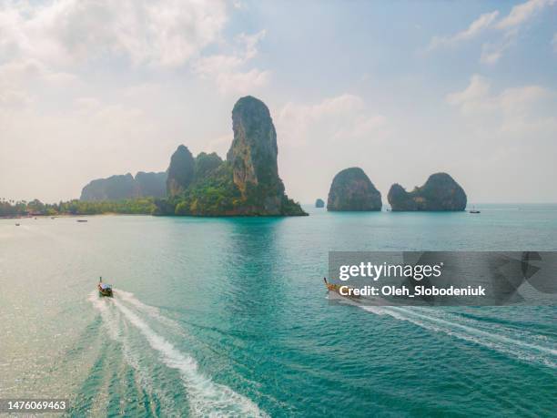 aerial view of speedboats near an island in andaman sea - speed boat stock pictures, royalty-free photos & images