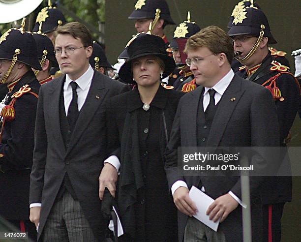 Prince Constantijn, his wife Laurentine and brother Prince Johan-Friso leave the funeral of their father, Prince Claus October 15, 2002 in Delft,...
