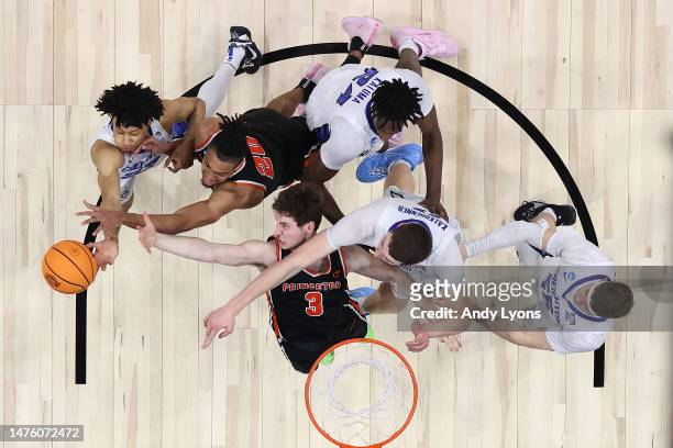 Ryan Langborg of the Princeton Tigers and Tosan Evbuomwan of the Princeton Tigers rach for a rebound against Trey Alexander of the Creighton Bluejays...