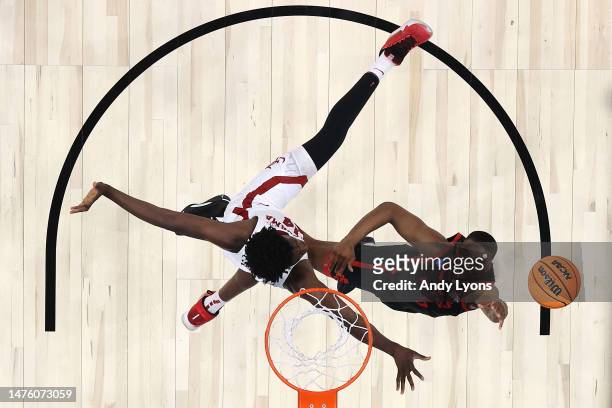 Lamont Butler of the San Diego State Aztecs lays up against Charles Bediako of the Alabama Crimson Tide during the second half in the Sweet 16 round...