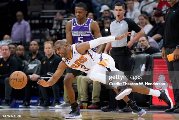 Chris Paul of the Phoenix Suns dribbling the ball get fouled by De'Aaron Fox of the Sacramento Kings during the third quarter at Golden 1 Center on...