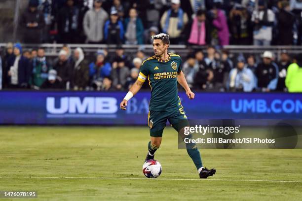 Gaston Brugman of LA Galaxy with the ball during a game between Los Angeles Galaxy and Sporting Kansas City at Children's Mercy Park on March 12,...