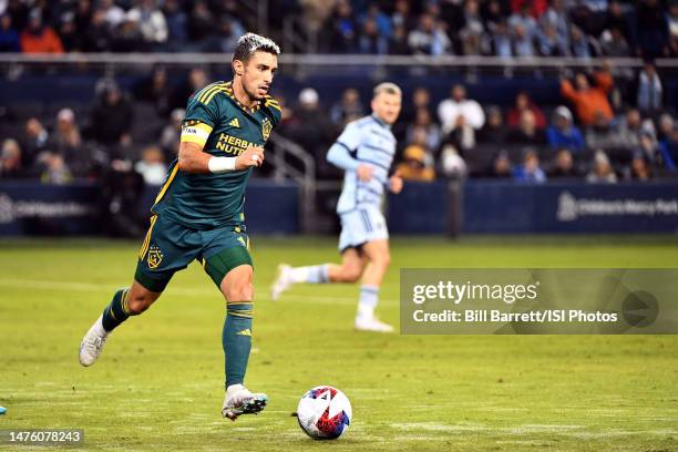 Gaston Brugman of LA Galaxy with the ball during a game between Los Angeles Galaxy and Sporting Kansas City at Children's Mercy Park on March 11,...