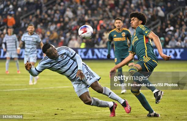 William Agada of Sporting Kansas City tries to head the ball in frame as Jalen Neal of Los Angeles Galaxy tries to block his shot during a game...