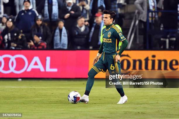 Riqui Puig of LA Galaxy with the ball during a game between Los Angeles Galaxy and Sporting Kansas City at Children's Mercy Park on March 12, 2023 in...