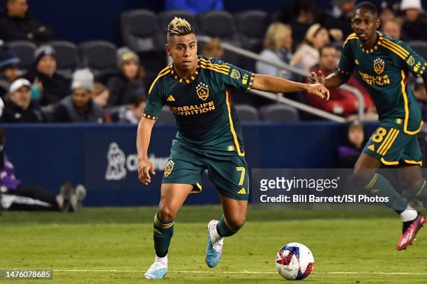 Efrain Alvarez LA Galaxy with the ball during a game between Los Angeles Galaxy and Sporting Kansas City at Children's Mercy Park on March 12, 2023...